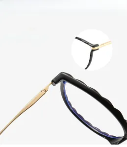 Macro view showing durable metal hinge and mortise temples on round TR90 glasses