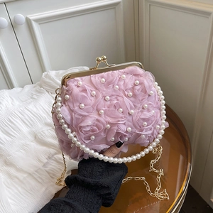 Pink pearl flower clutch bag with gold metal clasp and versatile shoulder chain straps