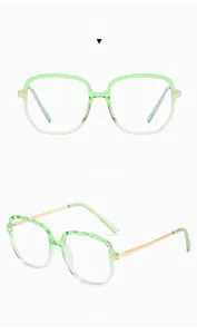 Detail of green gradient TR90 glasses frames with textured rims and gold metal temples