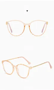 Detailed views of TR90 tea-colored round glasses with gold metal temples and faceted frame