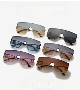 Detail of oversized flat top sunglasses with gradient lenses and metal link decor