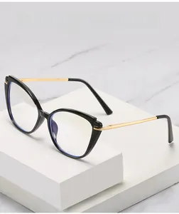 Detailed shot of cat-eye frames with gold metal temples and blue light blocking coating