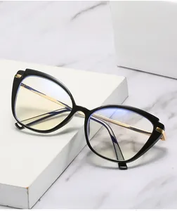 Detailed view of cat-eye glasses with anti-blue ray lenses and gold metal temples