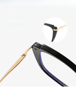 Detail view of durable metal hinges and reinforced mortise temples on cat-eye glasses