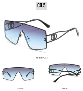 Close-up of oversized square sunglasses featuring hollow link temple design and gradient lenses