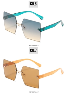 Close-up of rimless square sunglasses with gradient lenses and gold bridge at 45 degree angle