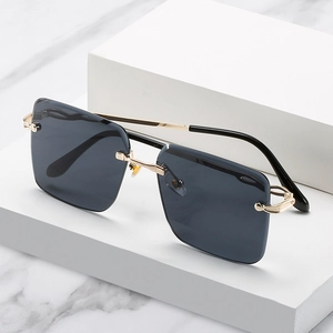 Lunettes de soleil carrées sans monture avec métal doré et verres gris foncé