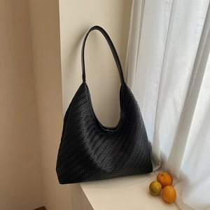 Minimalist black woven hobo tote bag with large capacity and wide leather shoulder strap