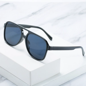 Classic retro pilot sunglasses with black double-bridge frame and dark smoke lenses