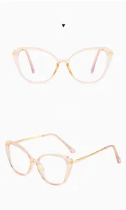 Cat eye glasses frames in tea color with slim golden metal temples shown in dual views