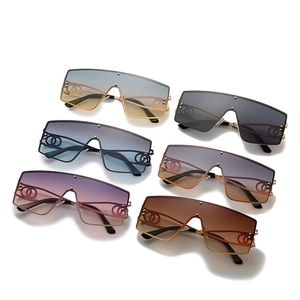 Oversized one-piece square sunglasses with hollow metal temples in assorted gradient colors