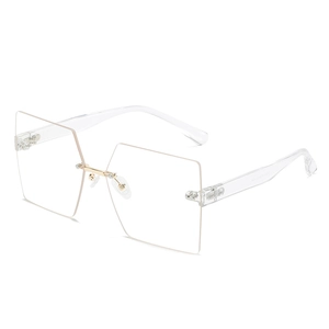 Frameless square sunglasses for women with transparent brown lenses and gold metal bridge