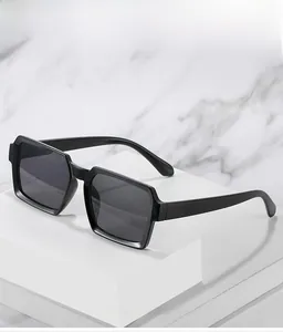 Macro shot of retro rectangular black frame sunglasses with thick texture material