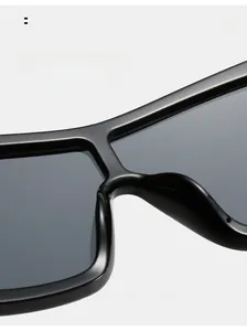 Detail of comfortable integrated nose pads on oversized black square frame sunglasses
