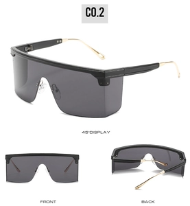 Three-angle display of oversized shield sunglasses with gold temples and dark grey lenses