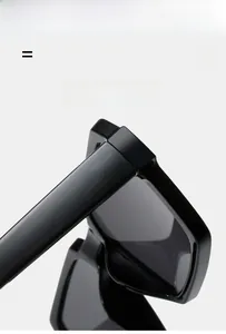 Detail view of durable hinges and glossy black texture on vintage rectangle sunglasses