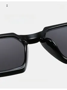 Detail view of comfortable integrated nose pads on black rectangular sunglasses