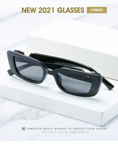 Detail of black rectangular sunglasses with golden geometric metal decor on temples