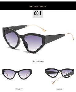 Detailed view of cat eye sunglasses with purple gradient lenses and gold metal temples