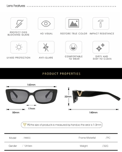 Detail view of black square sunglasses with golden V metal accent on the temple arm