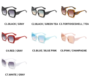 Flat lay of hexagonal polygon sunglasses in seven diverse vibrant frame and lens colors