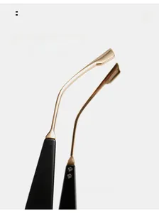 Detail of ergonomic curved gold metal sunglasses temples with black tips for comfort