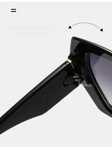 Detail of durable texture hinge and model code on black cat-eye polygon sunglasses