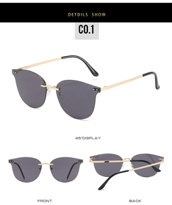 Detail view of rimless sunglasses with purple lenses and thin golden metal temples