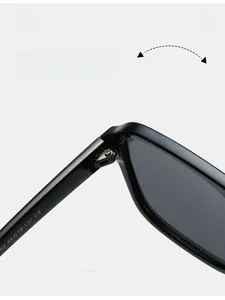 Macro shot of durable metal hinge and size parameters on black sunglasses temple