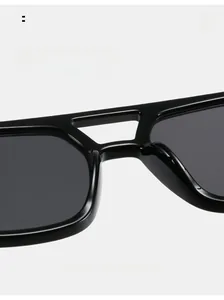 Detail of square black sunglasses showing smooth integrated nose pads for comfort