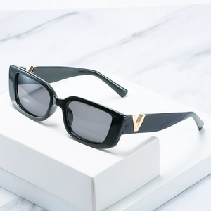 Modern square black sunglasses featuring golden V-shaped metal logo on temples