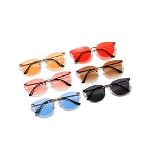 Frameless fashion sunglasses set in multiple colors with gold metal temples and rivets