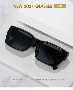 Detail of stylish wide-leg square frame sunglasses on a minimalist white display