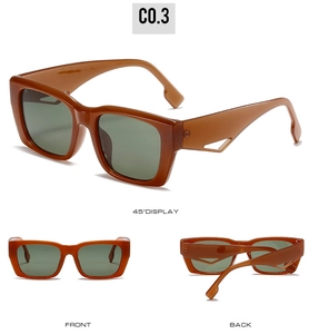 Detail view of oversized amber sunglasses with unique hollow geometric temple design