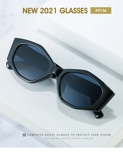 Detail of black irregular chunky sunglasses on a geometric stand with modern lens