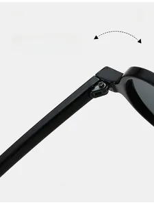 Macro shot of durable metal hinge construction on retro small round black sunglasses