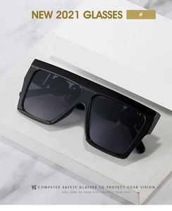 Detail of oversized flat top sunglasses with chic metal ring accents on the temple