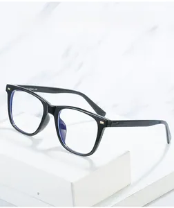Detail of square black TR90 frames with anti-blue light lenses and metal stud accents