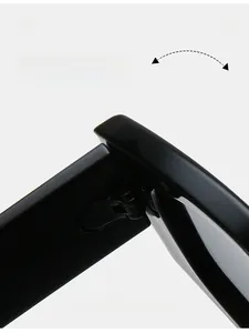 Detail of durable polished black hinge on irregular cat eye sunglasses frame