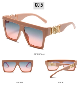Macro detail of nude square sunglasses featuring gradient lenses and gold floral temple accents