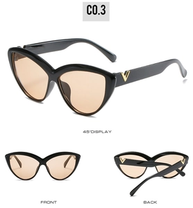 Detailed views of vintage cat eye sunglasses featuring gold V-shaped metal accents