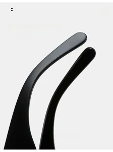 Detail view of matte black curved temple legs on large square sunglasses for comfort