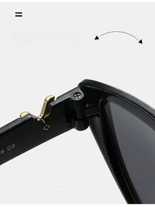 Detail of durable gold-tone reinforced hinges with 9 C2 marking on cat eye sunglasses