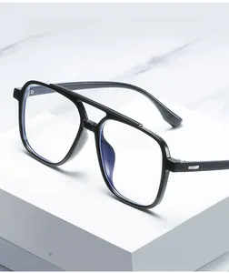 Detail of retro double-bridge pilot frame with anti-blue light lenses on marble background