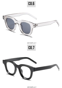 Detail view of oval tea green and black frame sunglasses from a 45-degree angle