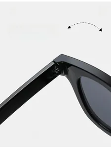Detail shot of durable metal hinges on high-gloss black oval sunglasses
