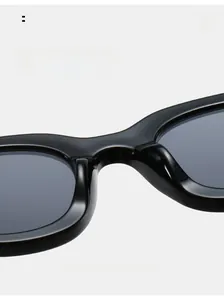 Detail of comfortable integrated nose pads on black thick frame oval sunglasses