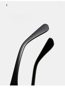 Macro shot of curved black sunglasses temples with ergonomic arc for comfortable wear