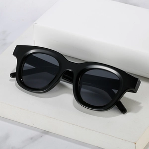 Classic black oval sunglasses with wide frames and dark lenses for men and women