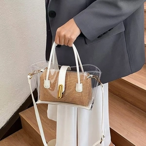 Transparent PVC basket bag with brown straw inner and white leather handles for summer style
